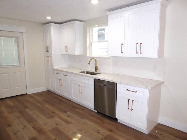 kitchen with dark hardwood / wood-style flooring, white cabinets, light stone counters, sink, and dishwasher