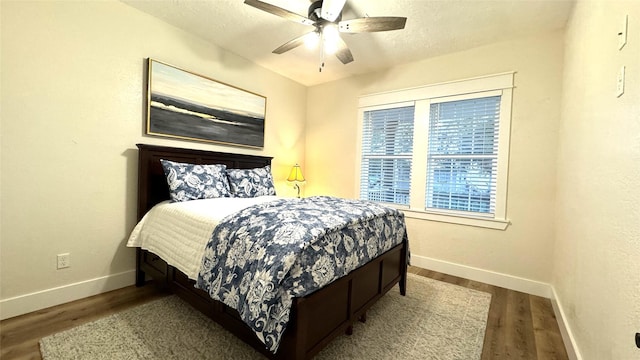 bedroom featuring ceiling fan and wood-type flooring