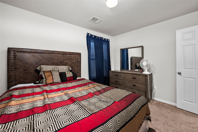 bedroom with light carpet