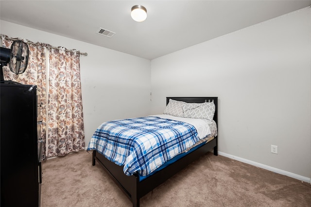 bedroom featuring carpet