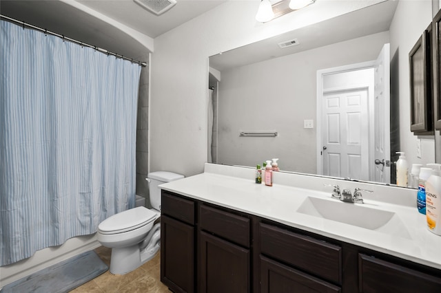 full bathroom featuring vanity, toilet, tile patterned floors, and shower / bath combo with shower curtain