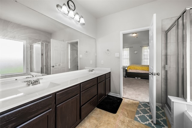 bathroom with plenty of natural light, vanity, and walk in shower