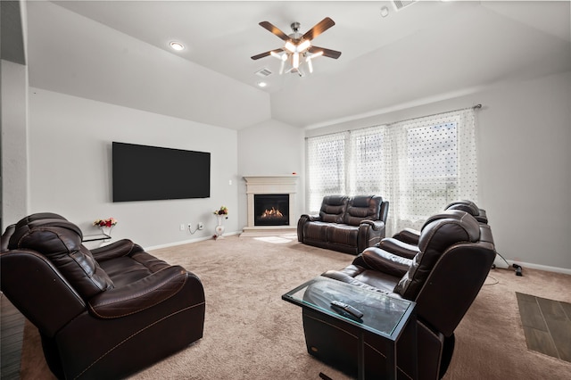 carpeted living room with vaulted ceiling and ceiling fan