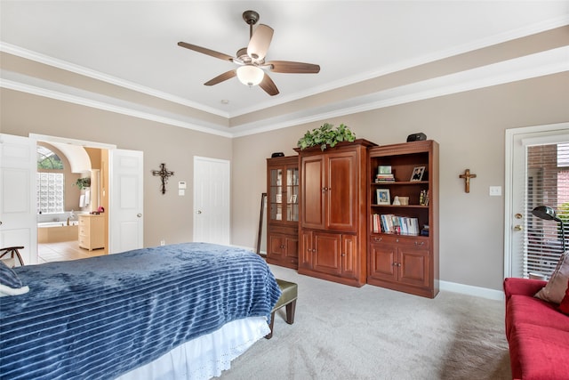 bedroom featuring ceiling fan, light colored carpet, connected bathroom, and crown molding