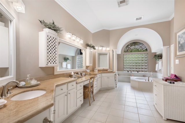 bathroom with a bathing tub, tile patterned flooring, ornamental molding, vanity, and vaulted ceiling