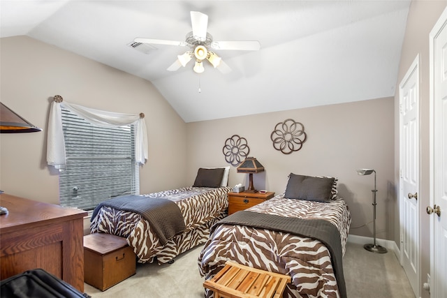 carpeted bedroom featuring lofted ceiling and ceiling fan