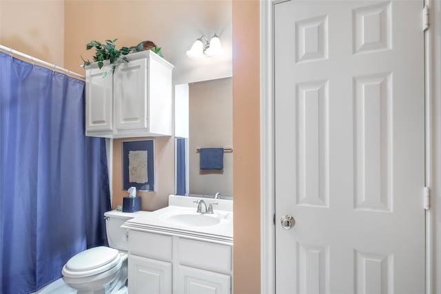 bathroom featuring vanity, toilet, and a shower with shower curtain