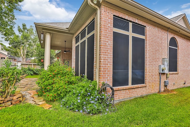 view of side of property with a yard