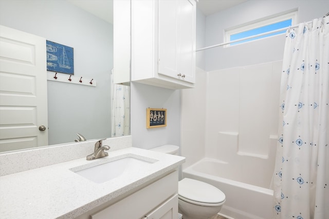 full bathroom featuring shower / bath combo with shower curtain, vanity, and toilet