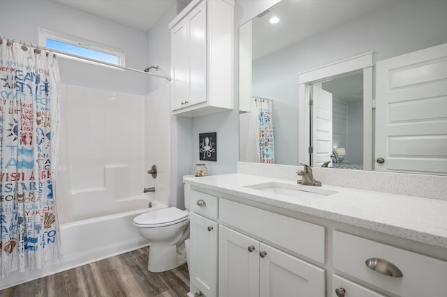 full bathroom featuring wood-type flooring, vanity, toilet, and shower / bathtub combination with curtain