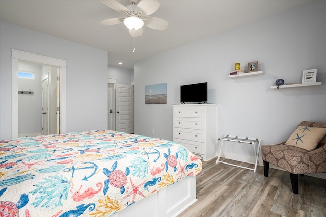 bedroom featuring hardwood / wood-style floors and ceiling fan