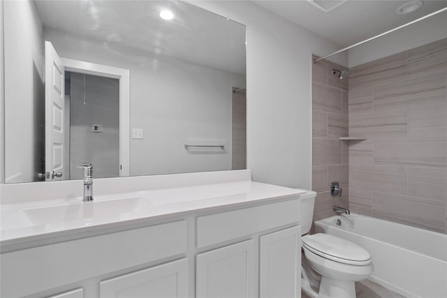 full bath featuring toilet, vanity, and shower / tub combination