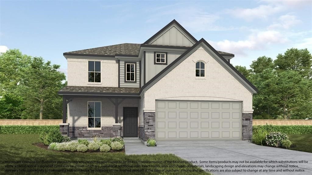 view of front of home with a garage and a front yard