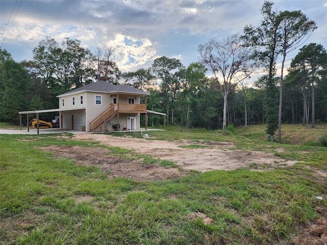 view of yard with a garage and a carport