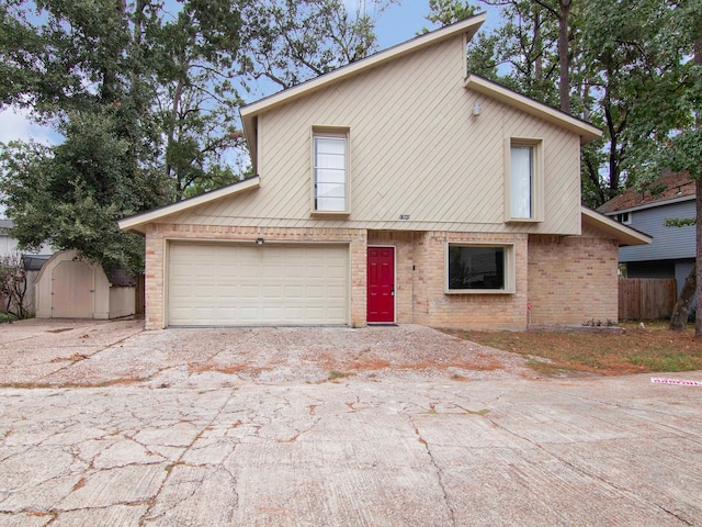 view of front of house featuring a shed and a garage