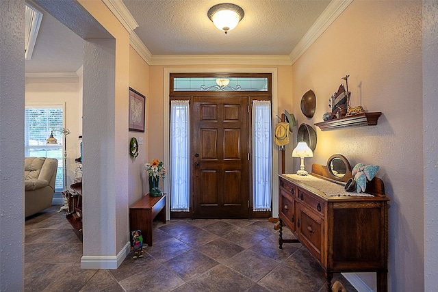 entrance foyer featuring a textured ceiling and crown molding