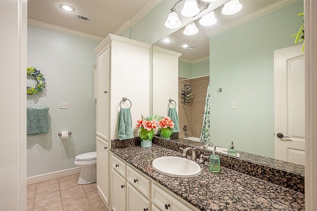 bathroom featuring a shower with shower curtain, vanity, toilet, ornamental molding, and tile patterned floors