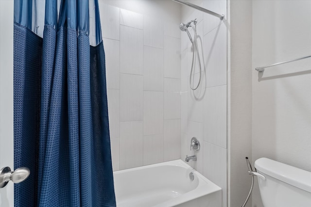 bathroom with shower / bath combo and toilet