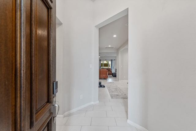 hallway featuring light tile patterned floors