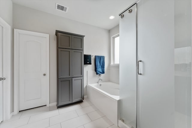 bathroom with plus walk in shower and tile patterned floors