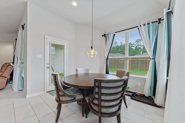 dining area with a healthy amount of sunlight and light tile patterned floors