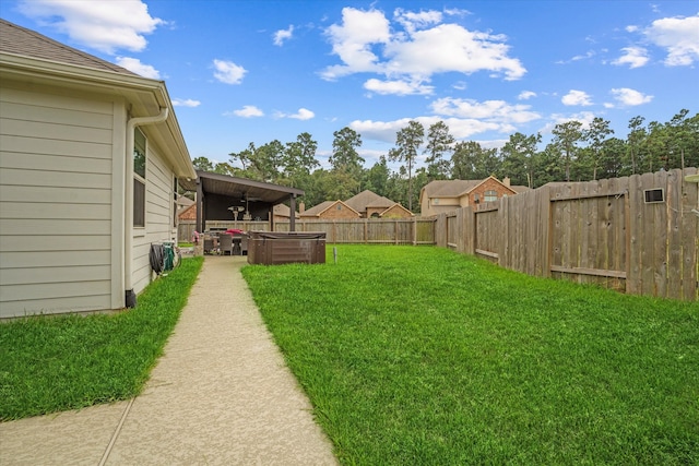 view of yard featuring ceiling fan and a patio area