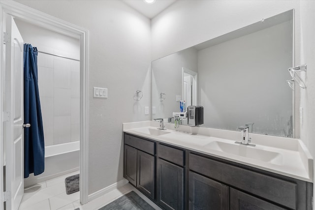 bathroom with tile patterned flooring, shower / tub combo with curtain, and vanity