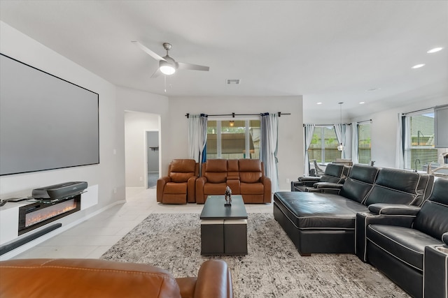 tiled living room featuring ceiling fan