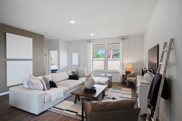 living room with dark hardwood / wood-style flooring