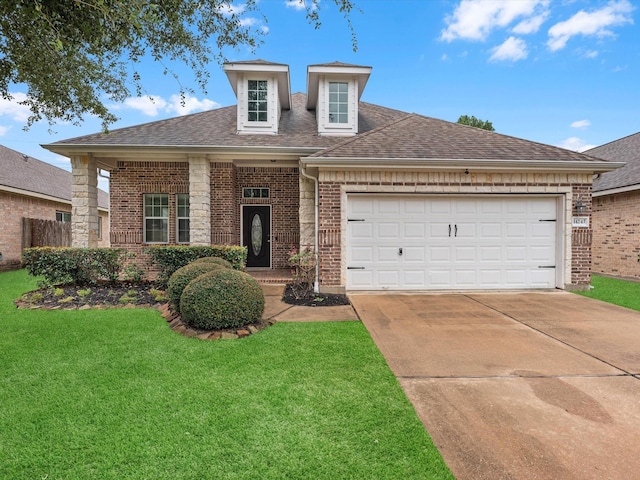 view of front of property with a front lawn and a garage