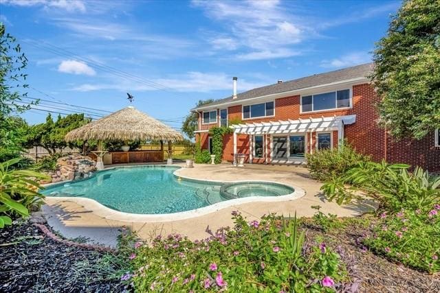 2601 Christopher Sq, Galveston, TX 77551 - view of pool featuring a gazebo, a pergola, a patio, a fenced backyard, and a pool with connected hot tub