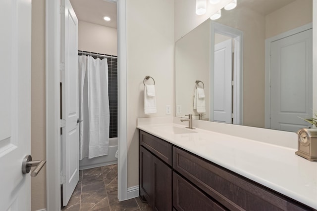 bathroom with vanity and shower / tub combo with curtain