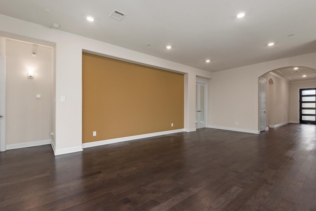 empty room with dark wood-type flooring