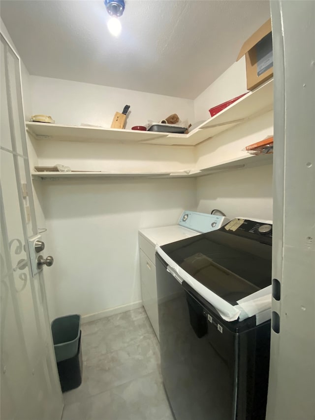 laundry area with washing machine and clothes dryer