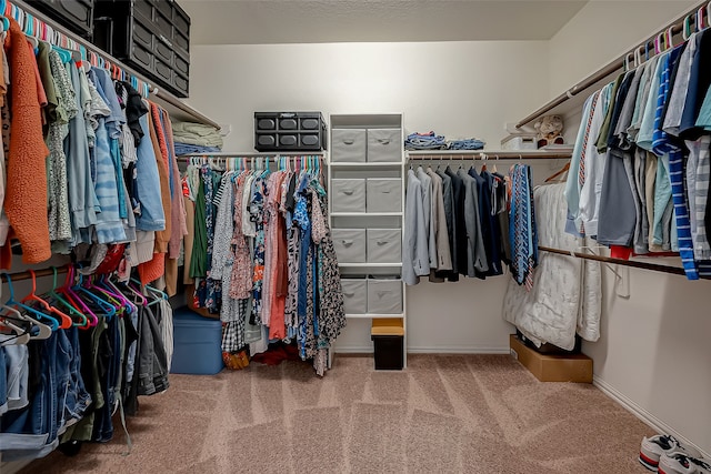 spacious closet with carpet flooring