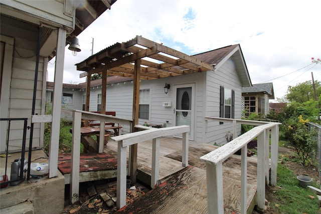 wooden deck featuring a pergola