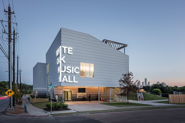 view of outdoor building at dusk