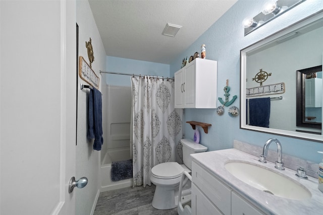 full bathroom with toilet, shower / tub combo with curtain, a textured ceiling, and vanity