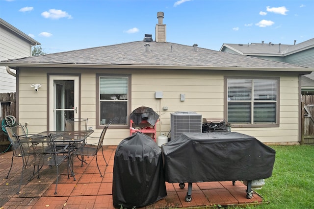 back of property featuring a patio area and central AC