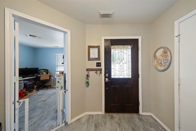 foyer with hardwood / wood-style flooring