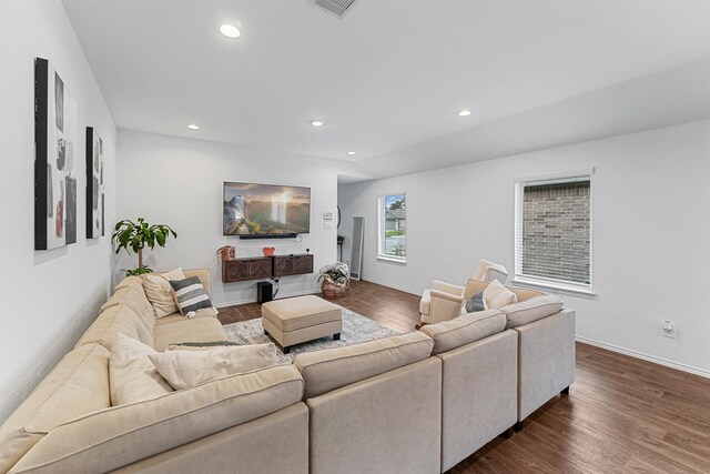 living room with dark hardwood / wood-style flooring