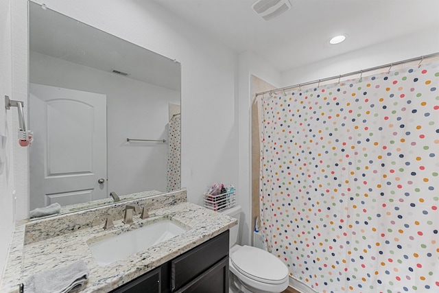 full bathroom with vanity, toilet, and shower / tub combo with curtain