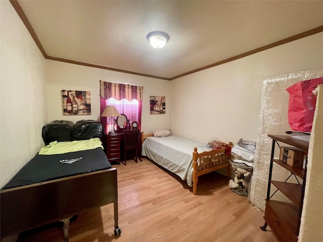 8860 S State Highway 71, El Campo, TX 77437 - bedroom with wood finished floors and crown molding