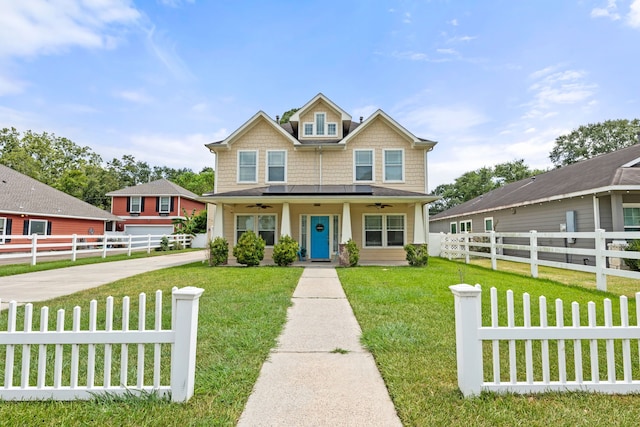 craftsman house featuring covered porch and a front yard