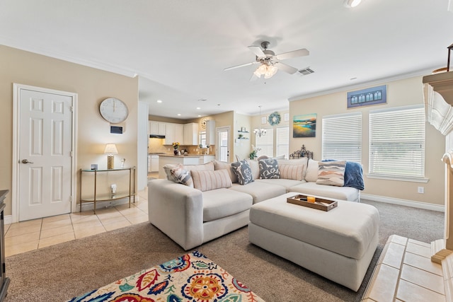 living room with ceiling fan, light tile patterned floors, and plenty of natural light