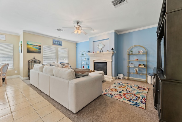 living room featuring crown molding, ceiling fan, and light tile patterned flooring