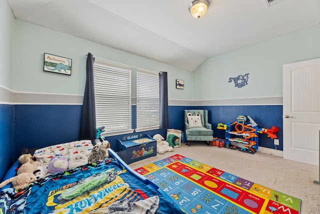 carpeted bedroom featuring vaulted ceiling