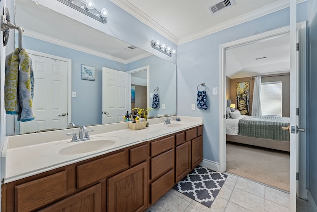 bathroom with crown molding, vanity, and tile patterned floors