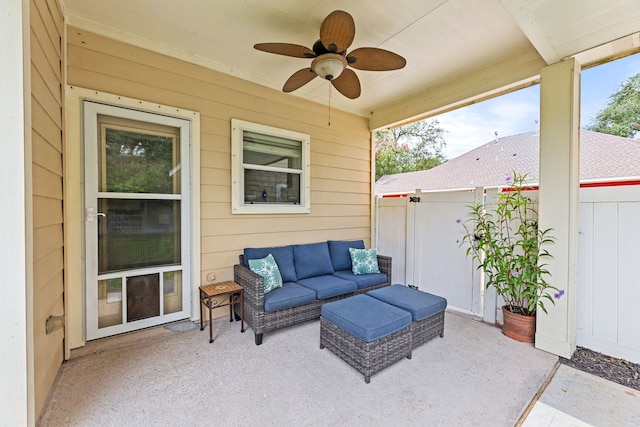 sunroom / solarium featuring ceiling fan