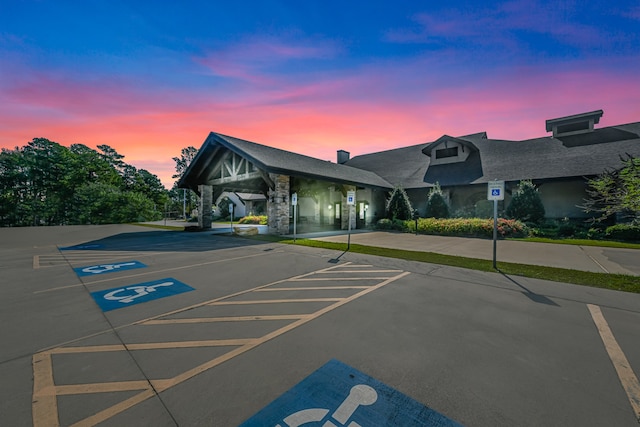 view of parking at dusk